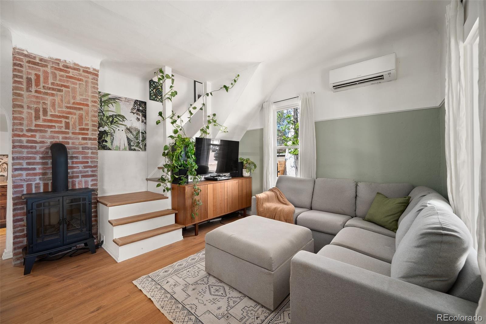 Living room and brick fireplace at 2471 South Galapago Street