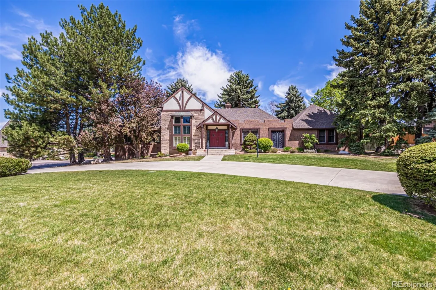 Brick home and front lawn at 5365 West Princeton Drive